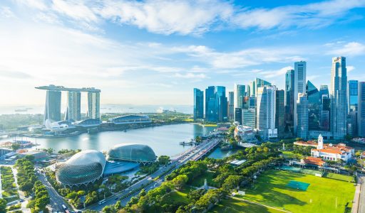 Beautiful architecture building exterior cityscape in Singapore city skyline with white cloud on blue sky